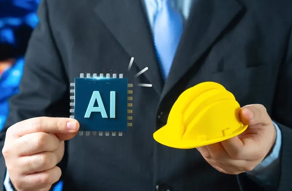 Business professional holding an AI microchip icon in one hand and a yellow construction hard hat in the other, representing artificial intelligence in the construction industry.