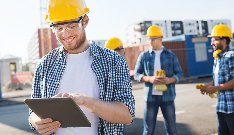Field technician reporting production on a tablet